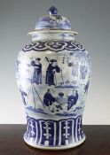 A large Chinese blue and white baluster jar and cover, 19th century, painted with figures playing