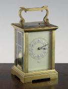 An early 20th century French brass hour repeating carriage clock, with enamelled arabic dial and