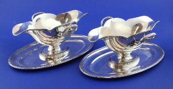 A pair of late 19th/early 20th century French 800 standard silver two handled double lipped