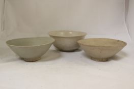 Two Chinese Ding ware bowls, Song dynasty and a blanc-de-chine bowl, 17th century, both Ding ware