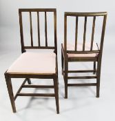 A pair of Edward VII mahogany coronation chairs, with slat backs and drop in seats, the rear seat
