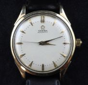 A gentleman`s 1950`s gold plated and steel Omega automatic wrist watch, with baton numerals,