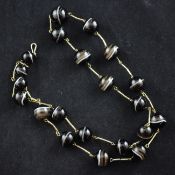 A graduated banded agate bead necklace, with gilt metal clasp and bar links, 24.25in.