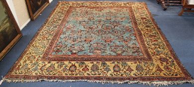 An Oriental carpet, with field of geometric foliate motifs, on a pale blue ground, with three row