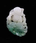 A Chinese jadeite carving of a boy above a dragon, 19th century, the boy holding a flag in his