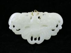 A Chinese pale celadon jade butterfly pendant, 19th century, well detailed to the underside with a