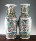 A pair of large Chinese Canton decorated famille rose baluster vases, late 19th century, each