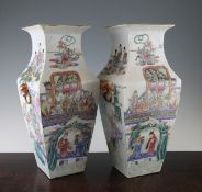 A pair of Chinese famille rose square baluster vases, Tongzhi period, each finely painted with the