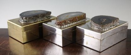 Three Anthony Redmile rectangular silver plated cigarette boxes, each lid mounted with a slice of