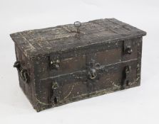 A 17th century iron bound Armada chest, the lid opening to reveal exposed locking mechanism, with