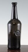 An English glass wine bottle, late 18th century, with `R` and coronet seal (John, Baron Rolle of