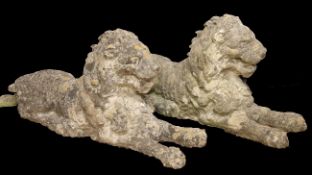 A pair of reconstituted stone recumbent lions, some damage, L.3ft long (not including tail)