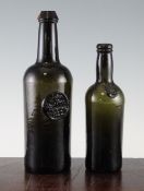 An English glass cylinder wine bottle, with `John Colby Fynone 1822` seal and half-size example with