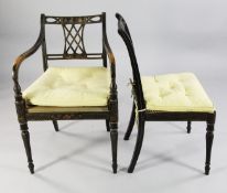 A Regency black japanned and parcel gilt open armchair, with a lattice splat back and cane seat,