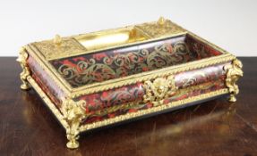 A late 19th century tortoiseshell and brass boulle work ormolu desk stand, with Egyptianesque corner