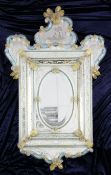 A 20th century Venetian engraved glass wall mirror, the frame with gold aventurine glass flowerheads