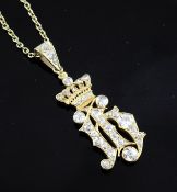 A high carat gold and diamond set drop pendant, modelled as a monogram? beneath a coronet, with an