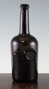 An early English glass cylinder wine bottle, c.1760, with `All Souls Coll, C R` seal 27cm.