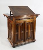 A late Victorian walnut and birds eye yew clerk`s desk, with hinged lectern top, drop down frieze