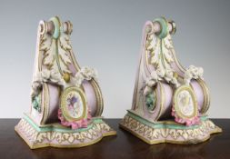 A pair of French coloured biscuit porcelain wall brackets, late 19th century, of neo-classical