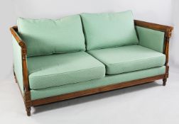 A modern beech framed Wesley Barrell Moreton sofa, with green patterned fabric, on turned feet