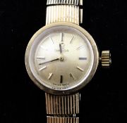 A lady`s 1960`s Omega manual wind wrist watch, with baton numerals, on an associated 9ct gold