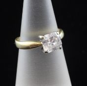 An 18ct gold and solitaire diamond ring, the radiant? cut stone measuring 6.87mm by 6.30mm by 3.