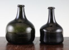 A rare English glass small mallet-shaped wine bottle, c.1720 and another onion-shaped wine bottle,