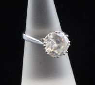 An 18ct white gold and solitaire diamond ring, the round brilliant cut stone weighing