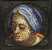 A 19th century Italian circular micro-mosaic plaque, depicting a young woman within a bronze mounted