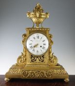 An impressive 19th century French ormolu mantel clock, of architectural form with urn surmount,