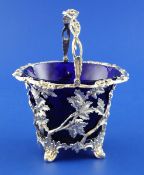 A Victorian silver sugar basket with blue glass liner by Edward & John Barnard, of tub form, with