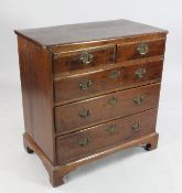 A George III yew wood chest, with two short and three long graduated drawers, on bracket feet, W.2ft