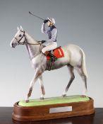 A Caughley biscuit porcelain group of Desert Orchid and Simon Sherwood, designed by R. Bensing, late