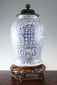 A large Chinese blue and white `Shuangxi` baluster vase, with rosewood cover and stand, 19th