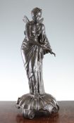 A late 19th century bronze figure of Psyche, holding a lamp in her right hand, standing on a