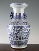 A Chinese blue and white baluster vase, early 20th century, painted with peonies and leaves to a