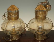 A pair of Davey & Co brass and glass hanging oil lamps, now converted for electricity, 17.75in.