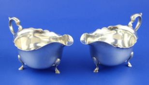 A pair of George V Scottish silver sauceboats, with cut rims and scroll handles, Hamilton &