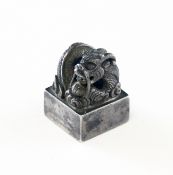 A small Chinese silver `dragon` seal, 19th century, the curling dragon on a square plinth, with four