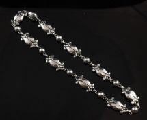 A Georg Jensen sterling silver necklace, `Moonlight Blossom` pattern, no. 15, with import mark for