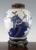 A Chinese blue and white ovoid jar, Transitional period, 17th century, painted with birds in