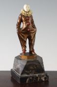 G. Danzmann. An Art Deco painted bronze and ivory figure of a Pierrot, on shaped marble plinth and