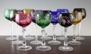 Two sets of six colour flashed hock glasses, 20th century, the globular bowls decorated with