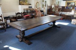 A large oak refectory table, the rectangular top with cleated ends, on large gadrooned and