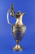An early 19th century Austrian silver Neo-Classical style claret jug, with Bacchus handle, foliate