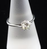 An 18ct white gold and platinum solitaire diamond ring, the round brilliant cut stone weighing