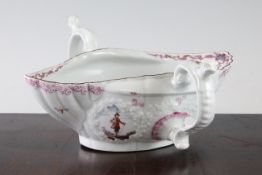 A rare Worcester polychrome double lipped sauceboat, c.1756-8, the exterior painted to four leaf