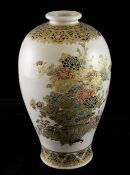 A Japanese Satsuma pottery baluster vase, Meiji period, decorated in raised gilt and enamels with