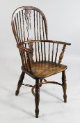 A 19th century yew, beech and elm Windsor chair, stamped for J.Spencer of Nottinghamshire, with
